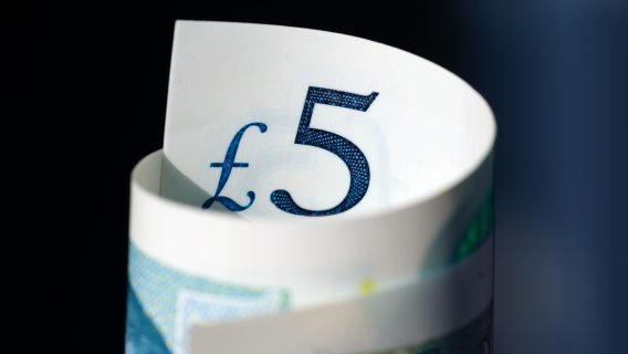 five pound note rolled up