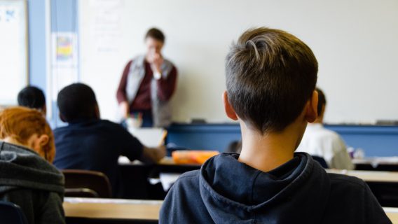 Boy sitting in class learning