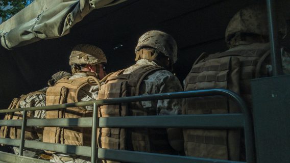 soldiers sitting in a truck