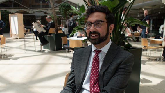 Abbas, a Commons Library researcher, sat in the atrium of Portcullis House in Parliament.